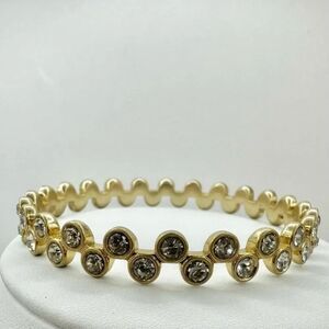 Gold tone and rhinestone bangle bracelet